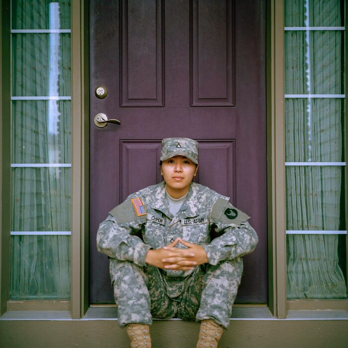 A woman in a military uniform sitting on a doorstep. Hilarious micro feminism clap backs.