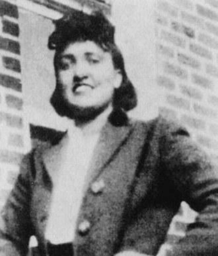 Black and white close-up of Henrietta Lacks, smiling slightly, showcasing coolest history facts.