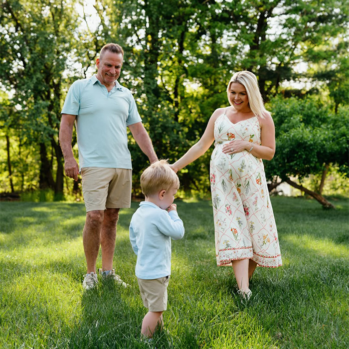 Karoline Leavitt, her husband, and their child in a serene outdoor setting, illustrating the marriage age gap.
