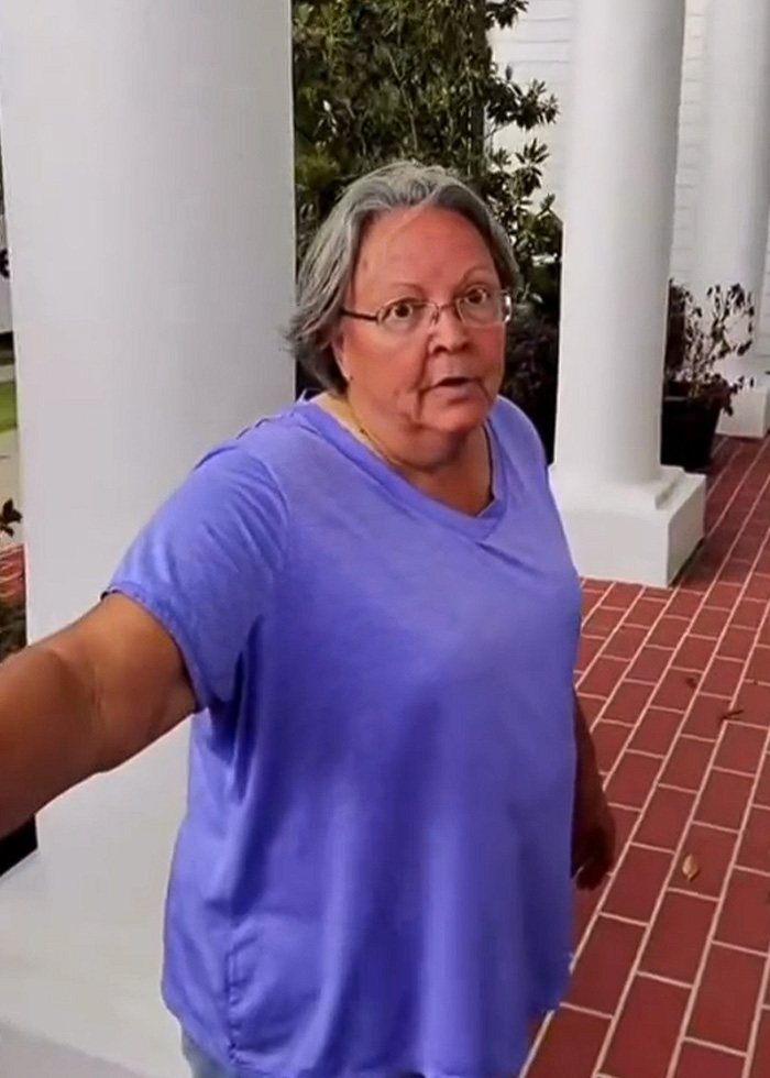 A White Karen in a purple shirt looking ballistic at a Hispanic window washer. A White Karen in a purple shirt looking ballistic at a Hispanic window washer.