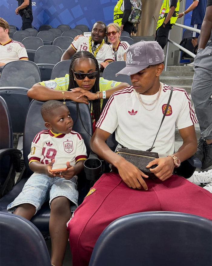 Family of a World Cup hero watches from the stands, showing support for the player and female fans. Family of a World Cup hero watches from the stands, showing support for the player and female fans.