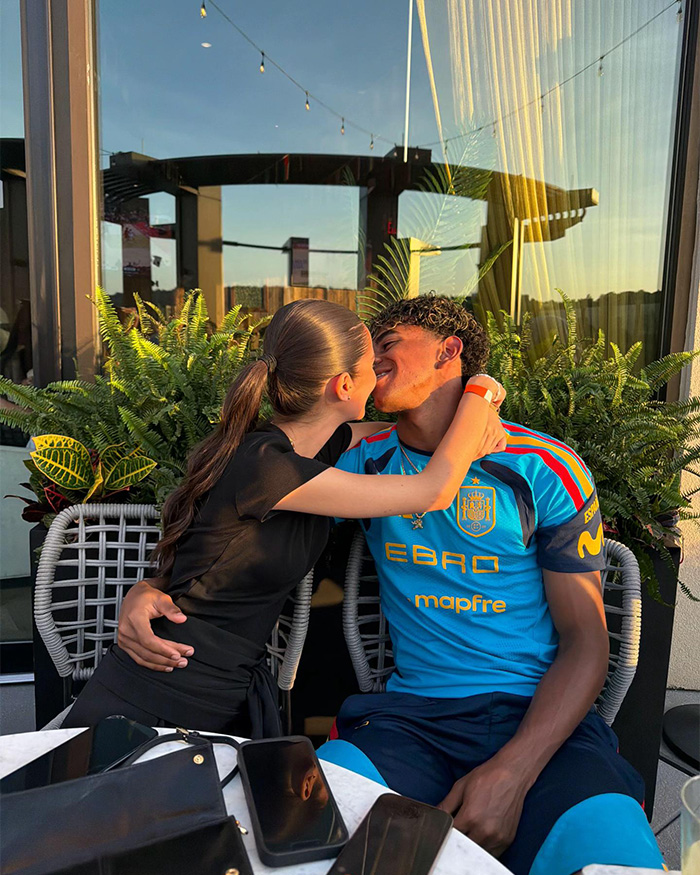 The World Cup hero and his girlfriend sharing a loving moment, embracing and kissing. The World Cup hero and his girlfriend sharing a loving moment, embracing and kissing.