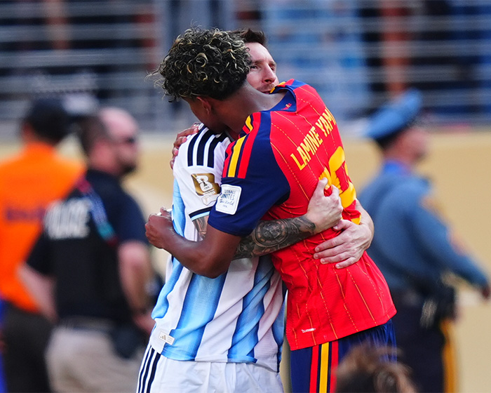 World Cup hero Lionel Messi embraces a fellow player after a match, highlighting sportsmanship for female fans. World Cup hero Lionel Messi embraces a fellow player after a match, highlighting sportsmanship for female fans.