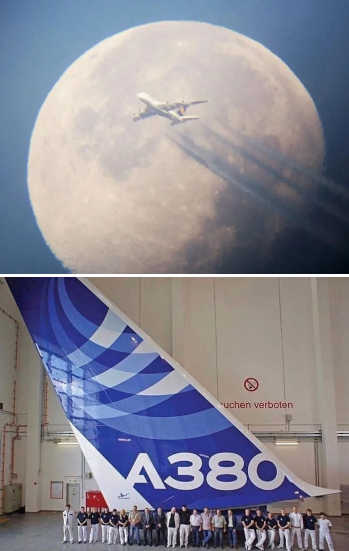 An A380 airplane flying in front of the moon and its massive tail fin, showcasing extremely large things.