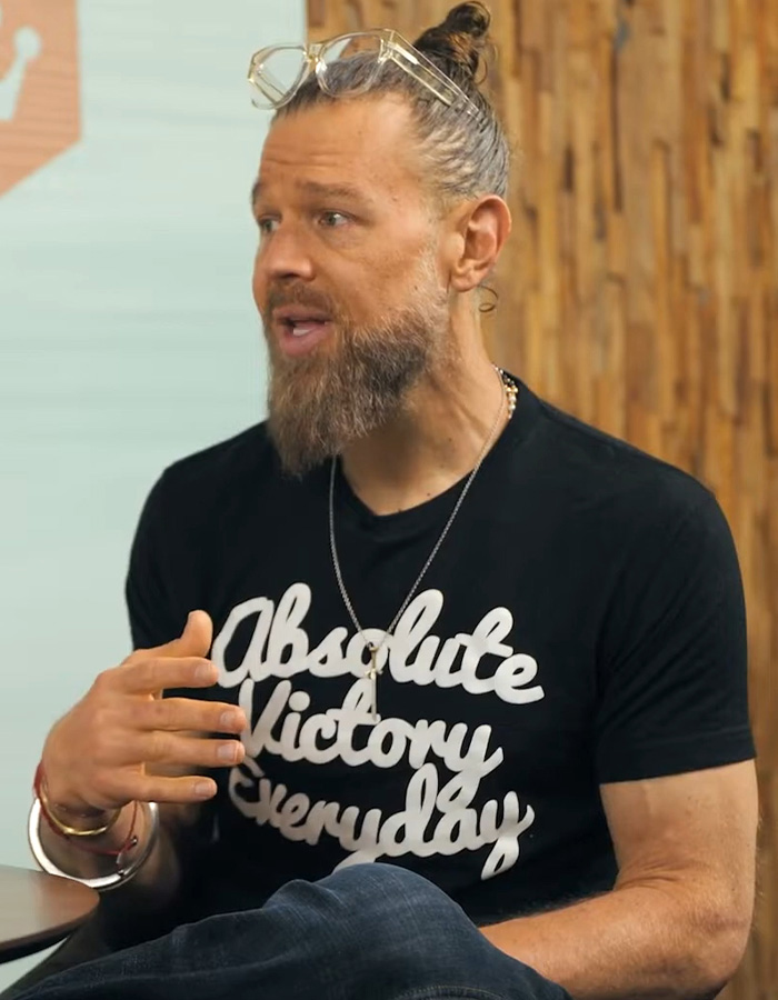 Lead actor talking, wearing a black T-shirt and glasses, discussing his Amazon series accident. Lead actor talking, wearing a black T-shirt and glasses, discussing his Amazon series accident.