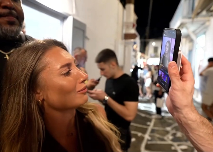 A young woman reacts as a Looksmaxxing influencer holds up a phone showing adult star Lily Phillips. A young woman reacts as a Looksmaxxing influencer holds up a phone showing adult star Lily Phillips.