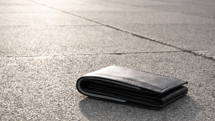 Lost wallet on the ground, representing a moment of instant justice.