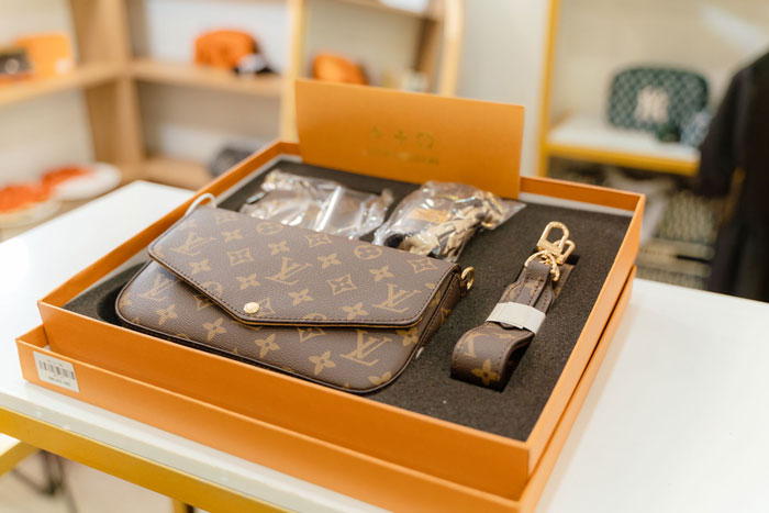 A brand new Louis Vuitton designer bag in its original packaging, possibly a fake one given back to a trusting friend. A brand new Louis Vuitton designer bag in its original packaging, possibly a fake one given back to a trusting friend.