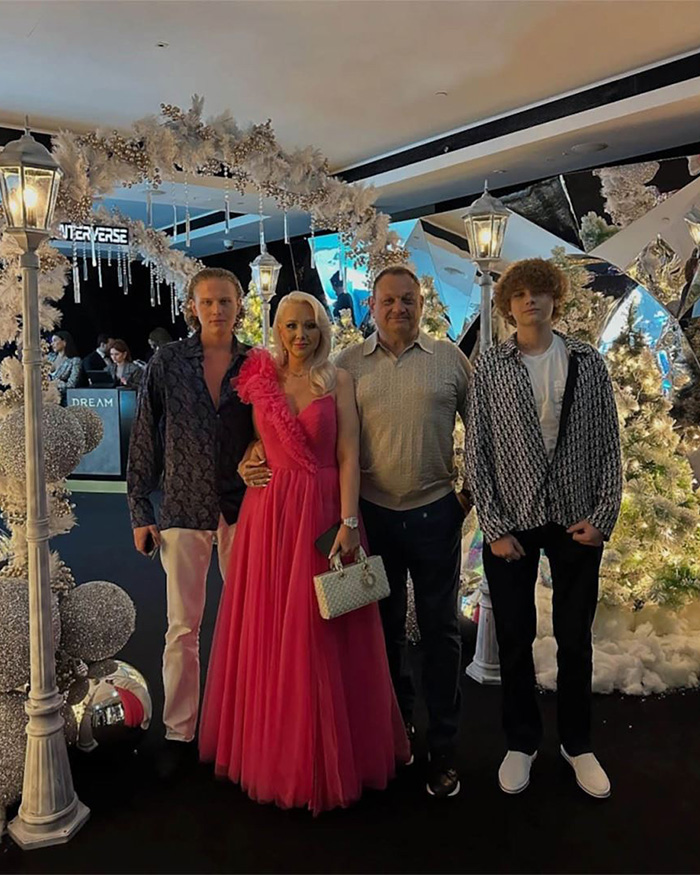 Family photo at a party, contrasting with the dark events a famous model faced. Family photo at a party, contrasting with the dark events a famous model faced.