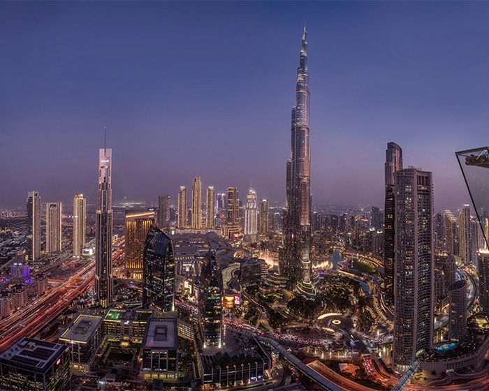 An illuminated cityscape at dusk, featuring modern skyscrapers and a prominent tall building, hinting at the glamorous life a model dreams of, before fighting for her life. An illuminated cityscape at dusk, featuring modern skyscrapers and a prominent tall building, hinting at the glamorous life a model dreams of, before fighting for her life.