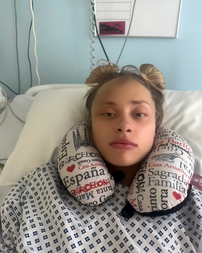 The famous model in a hospital bed with a neck pillow, fighting for her life after a party incident. The famous model in a hospital bed with a neck pillow, fighting for her life after a party incident.