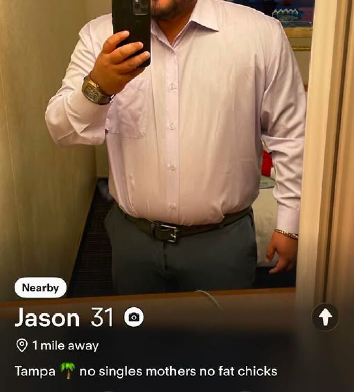 A dating profile of a guy named Jason, 31, with a photo of him and a caption saying no singles mothers no fat chicks, a funny example.
