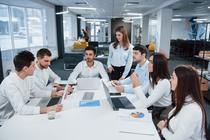 An ex-Meta worker's team collaborating in an office before AI replaced their roles and took their jobs. An ex-Meta worker's team collaborating in an office before AI replaced their roles and took their jobs.