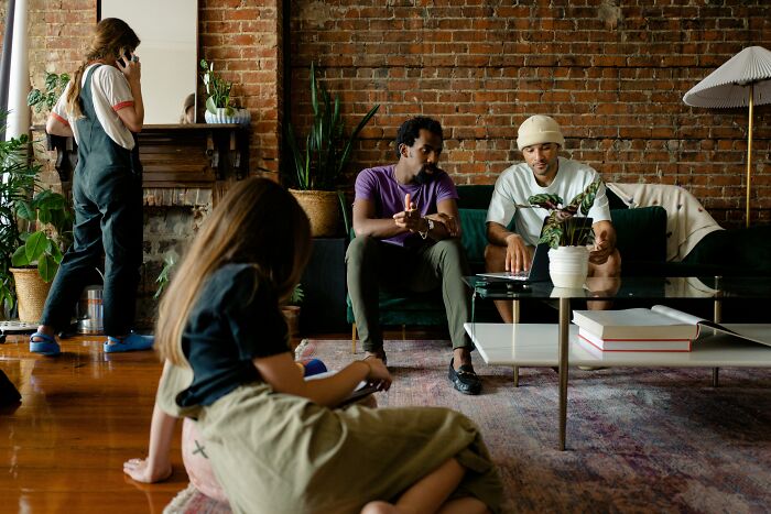 Group of people engaged in discussion, subtly revealing psychological red flags in their interactions.