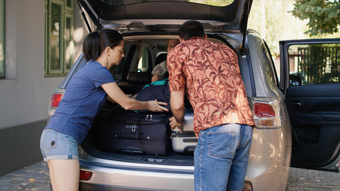 Family loads car for a trip, highlighting the car journey and family dynamics that led to family drama. Family loads car for a trip, highlighting the car journey and family dynamics that led to family drama.