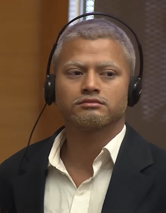 A man with light blonde hair and a beard, wearing headphones and a white shirt with a dark jacket, accused of mime terrorizing women. A man with light blonde hair and a beard, wearing headphones and a white shirt with a dark jacket, accused of mime terrorizing women.