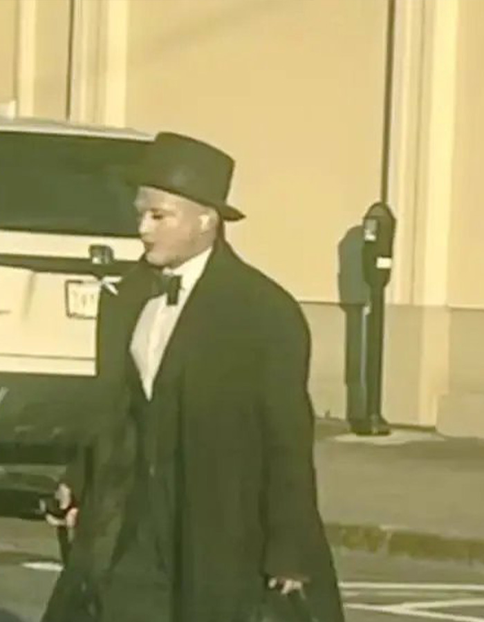 A person dressed as a mime in a black top hat, long coat, and bow tie, accused of terrorizing women with a cooking oil stunt. A person dressed as a mime in a black top hat, long coat, and bow tie, accused of terrorizing women with a cooking oil stunt.