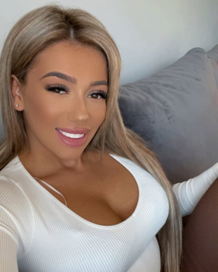 A woman with long blonde hair and heavy makeup, possibly a celebrity, linked to a mother passing away from botched surgery. A woman with long blonde hair and heavy makeup, possibly a celebrity, linked to a mother passing away from botched surgery.