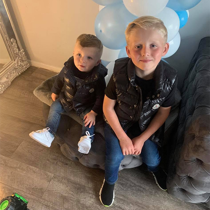 Two young boys sitting together, showing the children left behind after a mother's d***h from botched surgery. Two young boys sitting together, showing the children left behind after a mother's d***h from botched surgery.