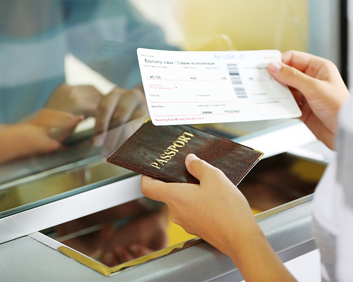 Hands holding a passport and boarding pass, representing travel for a barbaric surgery in Turkey that led to a mother's passing. Hands holding a passport and boarding pass, representing travel for a barbaric surgery in Turkey that led to a mother's passing.