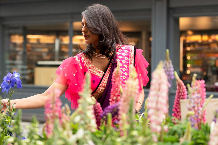 An entitled neighbor picking flowers from a man's garden, showing a clear act of treating it like a free florist.