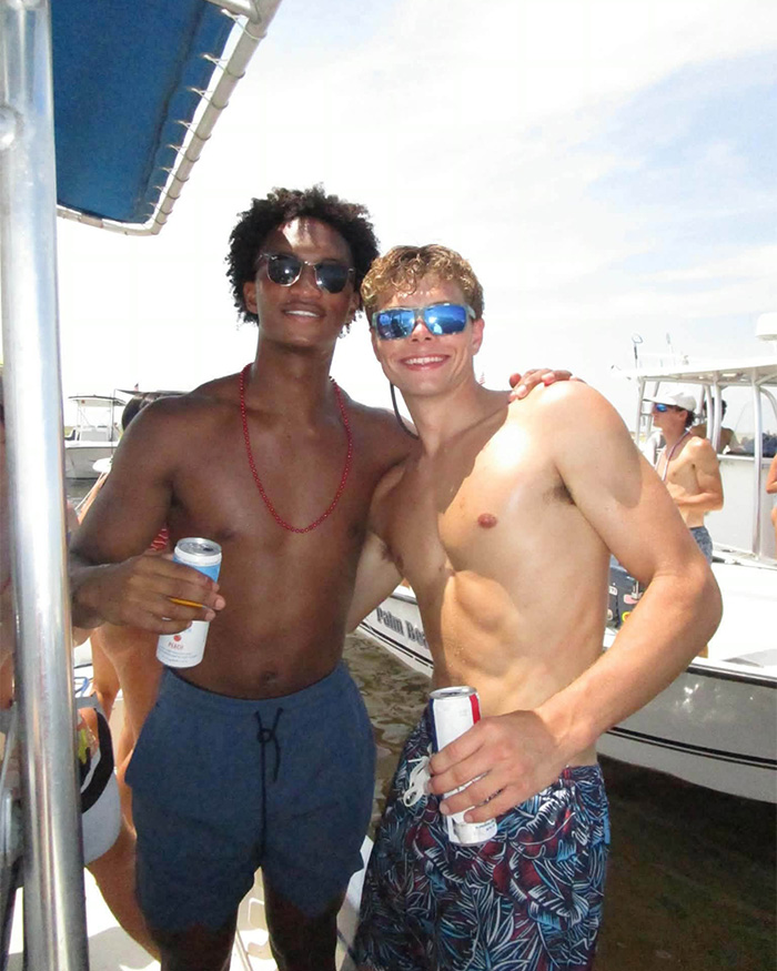Image of Nolan Wells with a friend on a boat, contributing to racial tensions as last moments videos emerge. Image of Nolan Wells with a friend on a boat, contributing to racial tensions as last moments videos emerge.