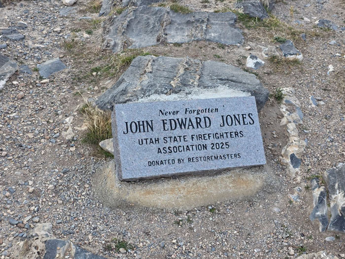 A memorial stone for John Edward Jones, the man trapped headfirst in Nutty Putty Cave.