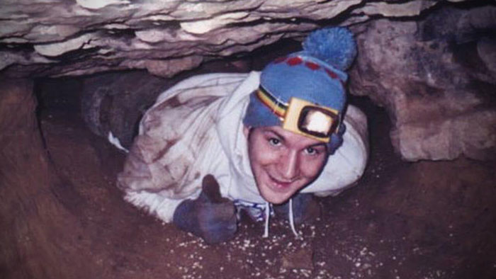John Jones, trapped headfirst in Nutty Putty Cave, gives a thumbs up to the cave rescuer.