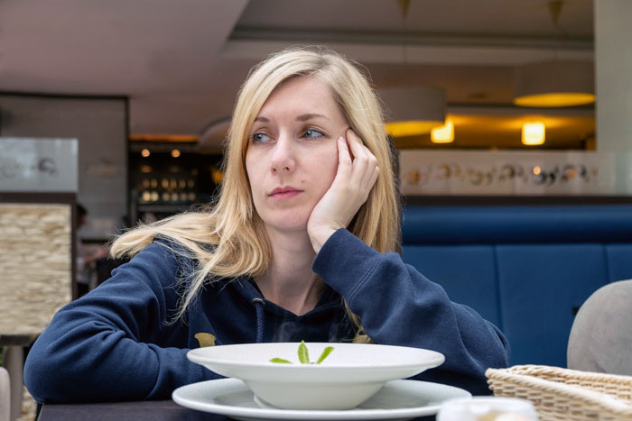 Man expecting a free steak and lobster dinner for GF looks upset with a frozen meal. Man expecting a free steak and lobster dinner for GF looks upset with a frozen meal.
