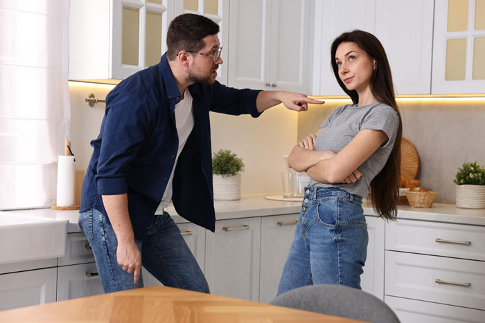 A man explodes at a woman, pointing his finger angrily after being offered a frozen meal instead of steak and lobster dinner. A man explodes at a woman, pointing his finger angrily after being offered a frozen meal instead of steak and lobster dinner.
