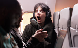 Woman Physically Stops Stranger From Reclining On An Overnight Flight, Throws A Tantrum