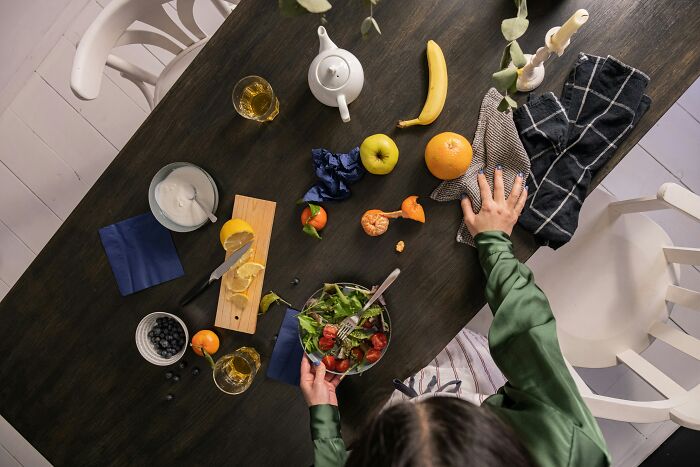 An overhead view of a table with healthy food, illustrating MILs stories and a vengeful spirit.