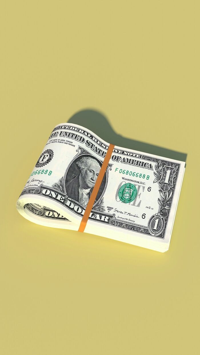 A stack of one-dollar bills wrapped with a rubber band, representing MILs stories.