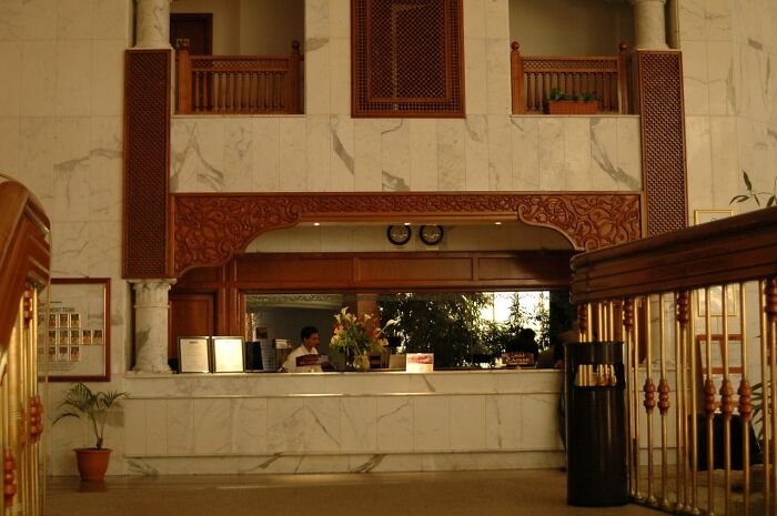 Hotel lobby with a reception desk, perhaps hinting at behind the scenes secrets in companies.