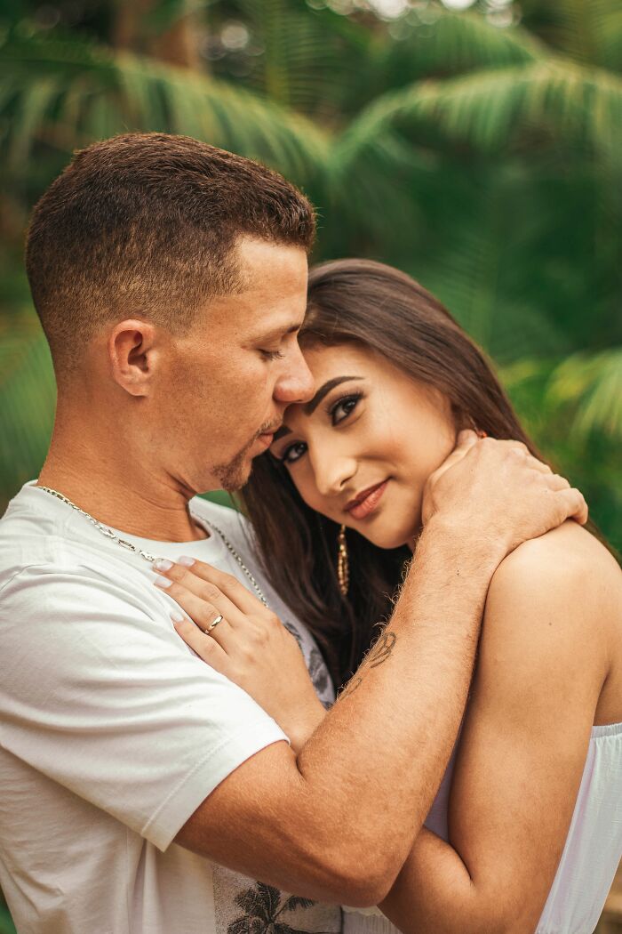 A couple embracing with affection, representing love and connection before getting married.