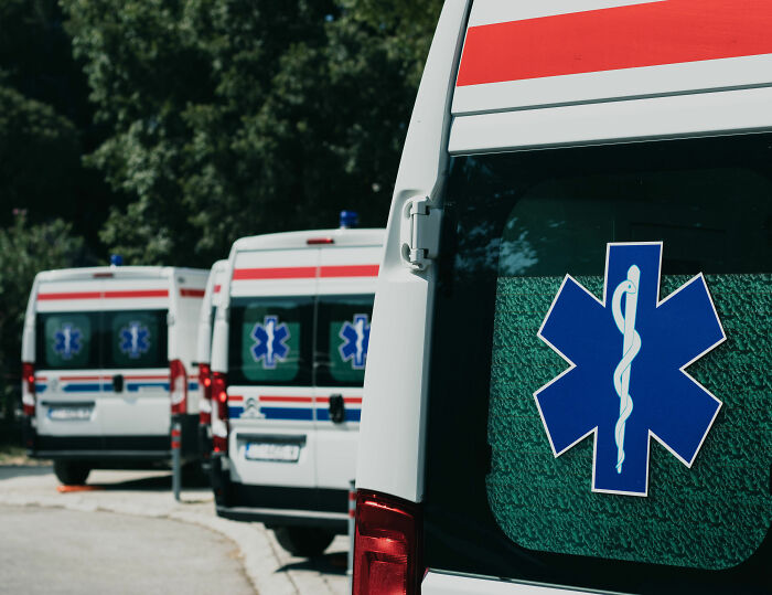 A line of ambulances, symbolizing the tragic event where Buddhist monks lost their lives and were injured. A line of ambulances, symbolizing the tragic event where Buddhist monks lost their lives and were injured.