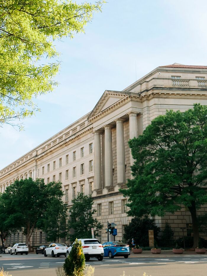 A large government building with classical architecture, revealing industry secrets of public sector jobs.
