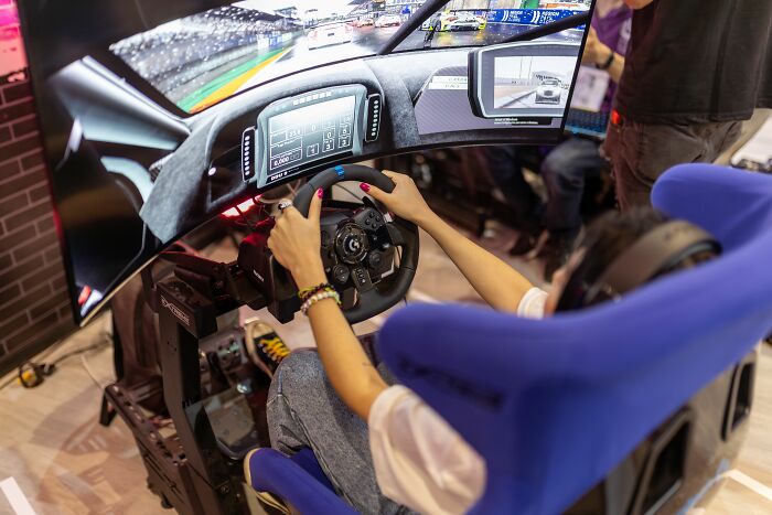 A person plays a driving simulator, an example of kids visiting a friend's house and finding different normals.