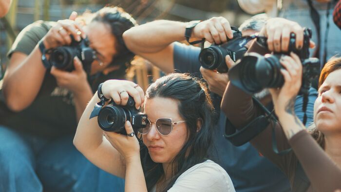 A group of paparazzi photographers capture images of celebrities before the fame. Recognize these soon-to-be famous faces.
