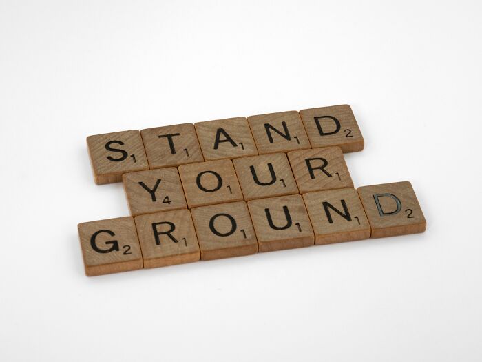 Scrabble tiles spelling out the English idiom STAND YOUR GROUND on a white background, useful for language learning and quizzes. Scrabble tiles spelling out the English idiom STAND YOUR GROUND on a white background, useful for language learning and quizzes.