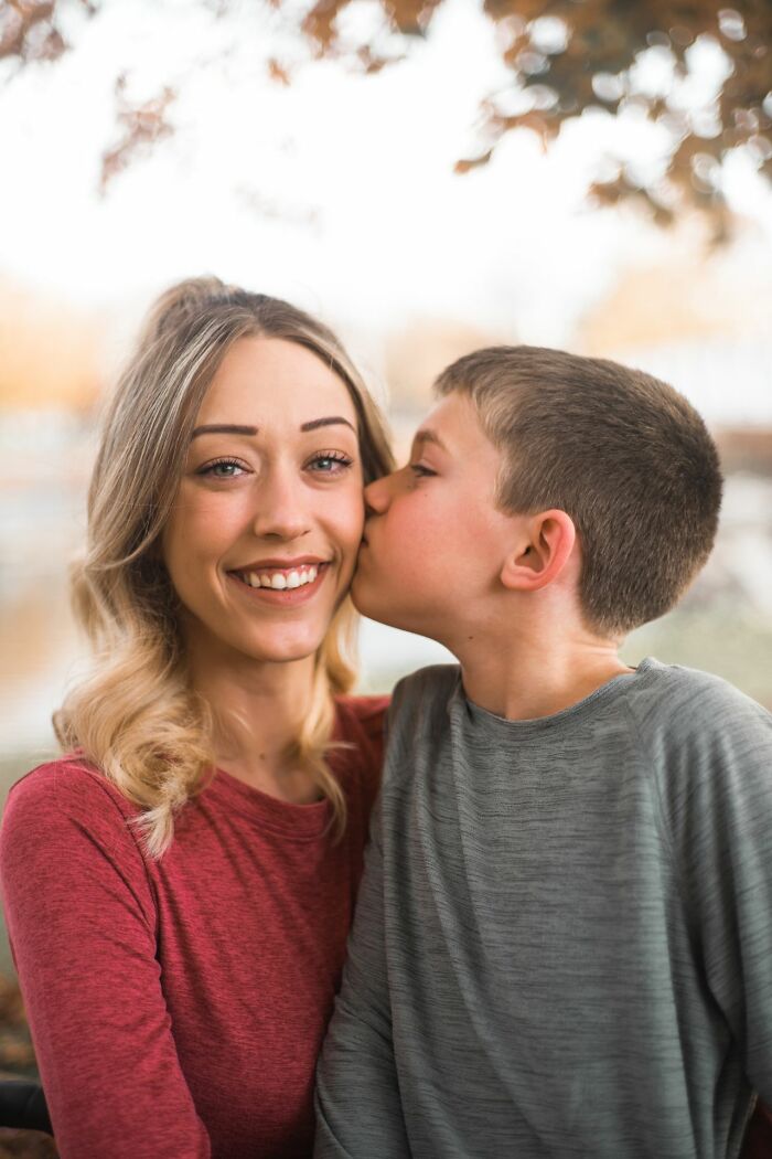 A young boy kissing a smiling woman on the cheek, illustrating stereotypically white phrases that crack people up.
