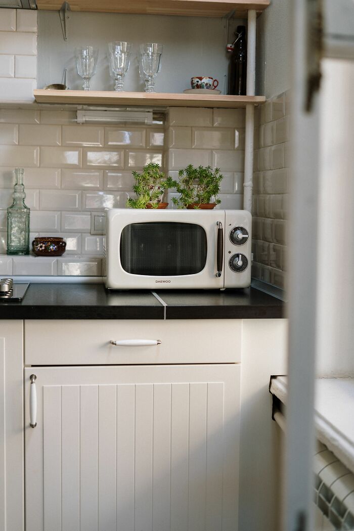 A microwave on a kitchen counter, a common sight on someone's final day at work.