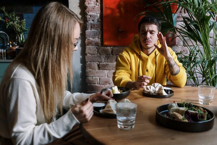 A couple having a tense meal, illustrating how women changed their minds about 'perfect' guys.