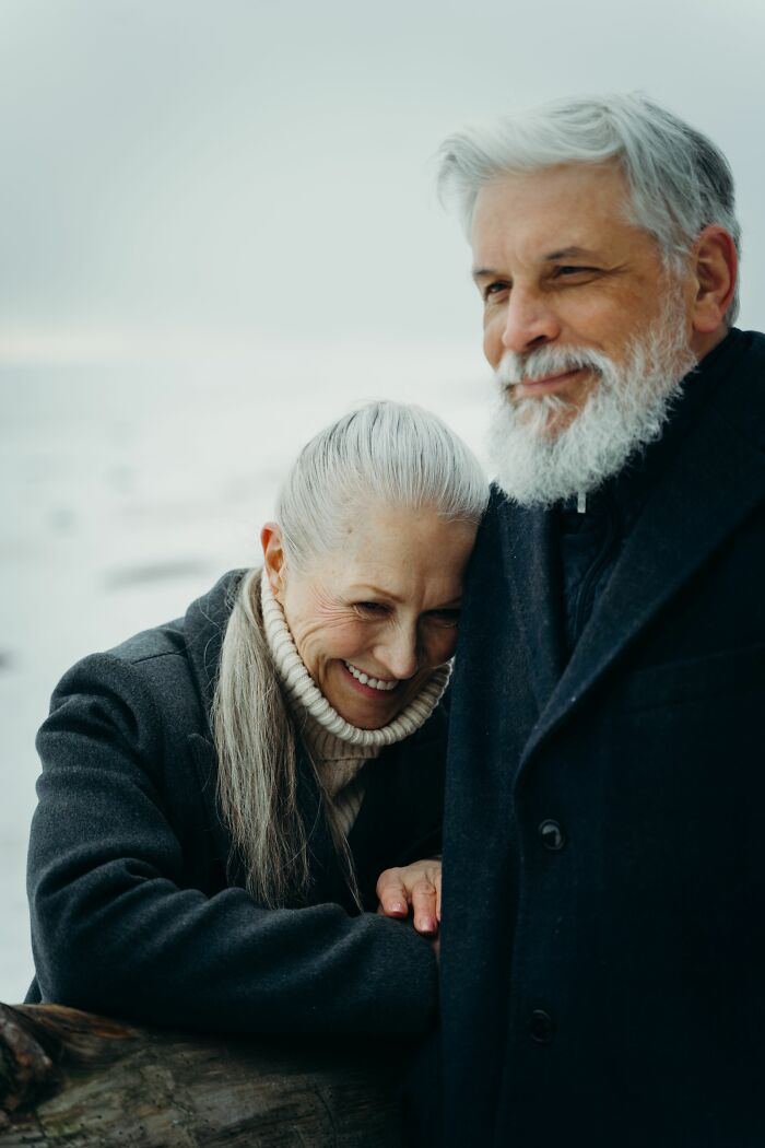 An elderly couple embracing outdoors, representing things to know before getting married.