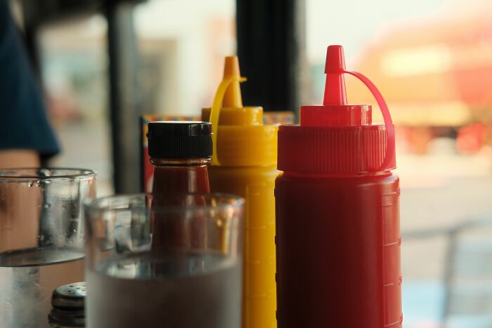 Condiment bottles on a table in a diner, representing places that failed health inspections.