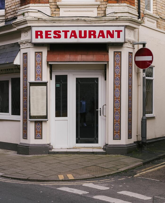 A restaurant exterior with a red sign, symbolizing establishments that failed health inspections for vegetarian reasons.