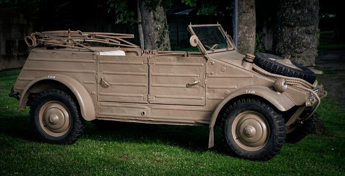A vintage military vehicle parked on grass, evoking World War II veterans' extraordinary stories.