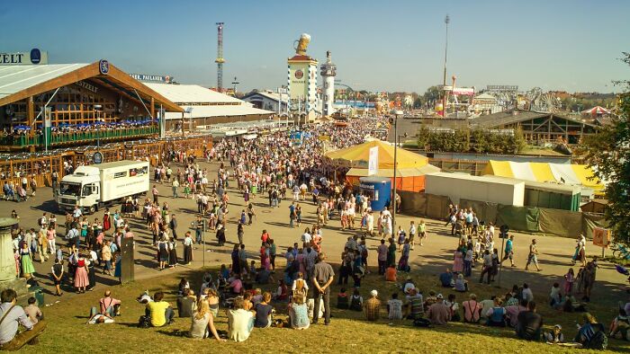 A large crowd at a fairground, a setting where public horror stories unfold.