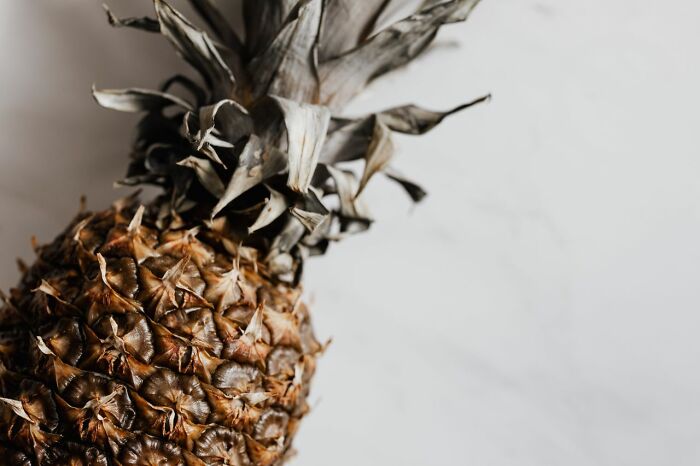A close-up of a pineapple, showcasing its textured skin. Disturbing facts changed the way people see the world.