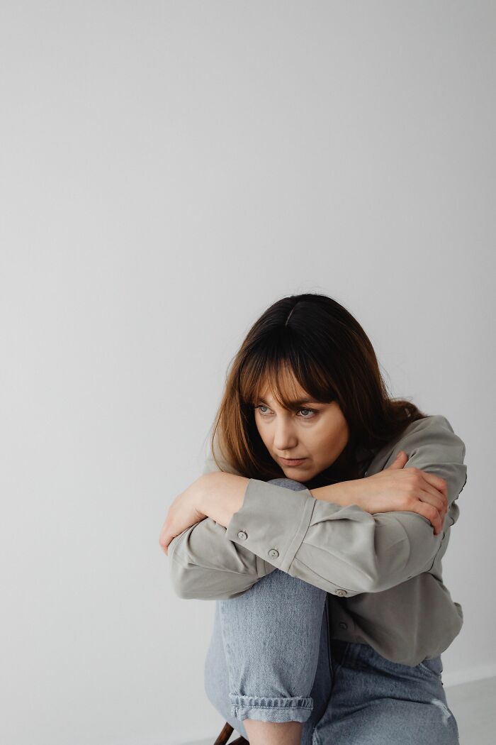 Woman looking sad and pensive, representing the emotional impact of recognizing psychological red flags.